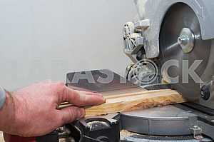 Carpenter tools on wooden table with sawdust. Circular Saw.