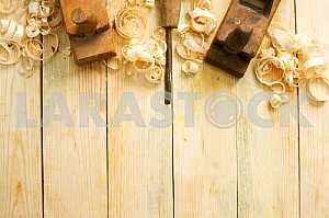 Carpenter tools on wooden table with sawdust. Circular Saw.