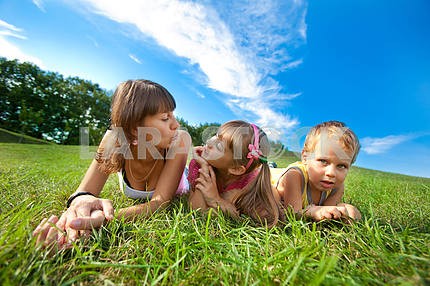 Mother with children goes on field