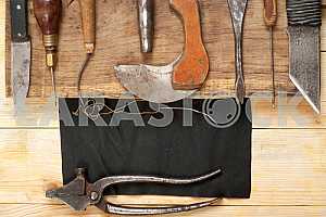 Carpenter tools on wooden table with sawdust. Circular Saw.