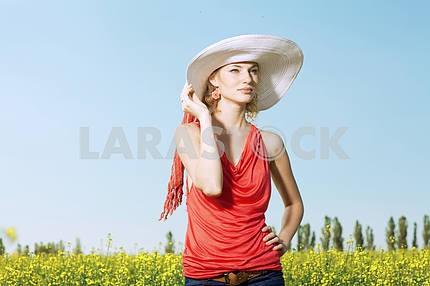 portrait of a beautiful young woman in a white hat