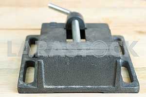 Different construction tools on a wooden background - screwdriver, caliper.