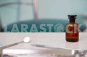Stomatological instrument in the dentists clinic. Operation, tooth replacement.