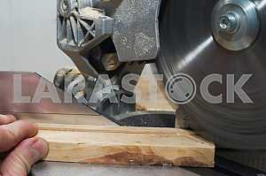 Carpenter tools on wooden table with sawdust. Circular Saw.