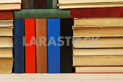 Stack of hardback books on table. Back to school. Copy space