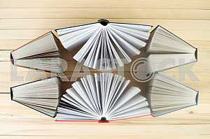 Stack of hardback books on wooden table. Back to school. Copy space