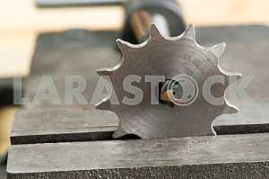 Different construction tools on a wooden background - screwdriver, caliper.