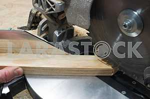Carpenter tools on wooden table with sawdust. Circular Saw.