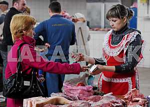 A woman sells meat on the market April 6, 2012