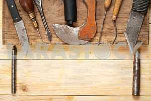 Carpenter tools on wooden table with sawdust. Circular Saw.