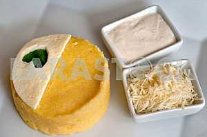 Banush - traditional ukrainian corn dish with cottage cheese and sour cream.