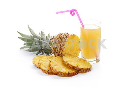 Pineapple with slices and juice in a glass 