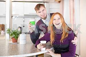 Young happy couple drinking tea in the morning