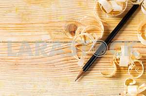 Carpenter tools on wooden table with sawdust. Circular Saw.