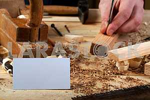 Carpenter tools on wooden table with sawdust. Circular Saw.