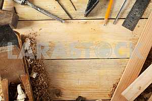 Carpenter tools on wooden table with sawdust. Circular Saw.