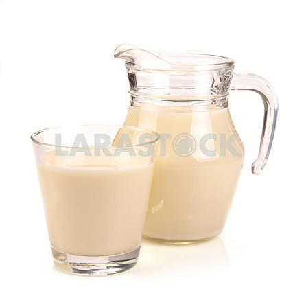 pitcher and a glass of milk