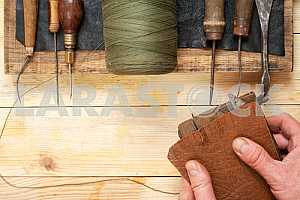Carpenter tools on wooden table with sawdust. Circular Saw.