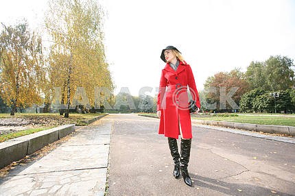 Beautiful blonde outdoors in coat and hat 