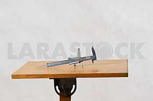 Different construction tools on a wooden background - screwdriver, caliper.