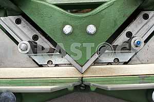Different construction tools on a wooden background - screwdriver, caliper.
