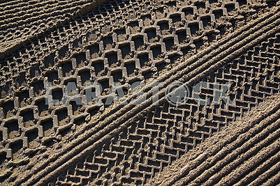 Cleaned by a tractor sand on the Mediterranean beach