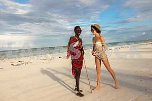 Zanzibar, a girl and a male Masai warrior