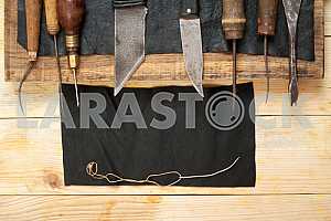 Carpenter tools on wooden table with sawdust. Circular Saw.