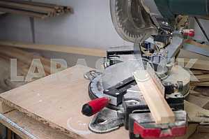 Different construction tools on a wooden background - screwdriver, caliper.