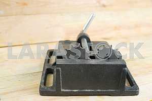 Different construction tools on a wooden background - screwdriver, caliper.