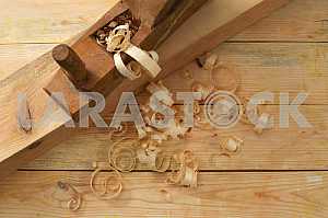 Carpenter tools on wooden table with sawdust. Circular Saw.