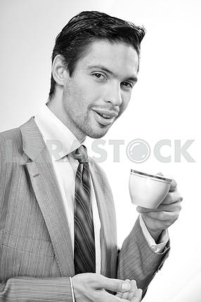 Businessman drinking coffee with a cup