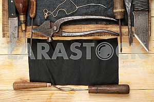 Carpenter tools on wooden table with sawdust. Circular Saw.