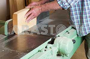 Carpenter tools on wooden table with sawdust. Circular Saw. Carpenter workplace top view