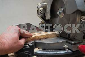 Carpenter tools on wooden table with sawdust. Circular Saw.