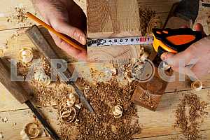 Carpenter tools on wooden table with sawdust. Circular Saw.