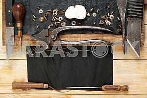 Carpenter tools on wooden table with sawdust. Circular Saw.