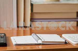 Stack of hardback books on wooden table. Back to school. Copy space. Top view