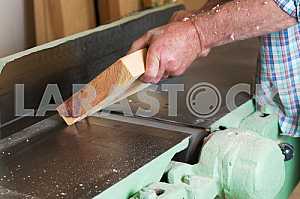 Carpenter tools on wooden table with sawdust. Circular Saw. Carpenter workplace top view