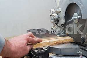 Carpenter tools on wooden table with sawdust. Circular Saw.