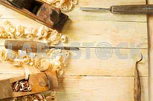 Carpenter tools on wooden table with sawdust. Circular Saw.