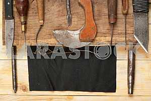 Carpenter tools on wooden table with sawdust. Circular Saw.