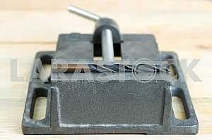 Different construction tools on a wooden background - screwdriver, caliper.