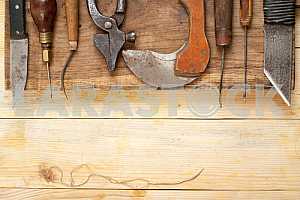 Carpenter tools on wooden table with sawdust. Circular Saw.