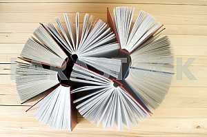 Stack of hardback books on wooden table. Back to school. Copy space