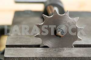 Different construction tools on a wooden background - screwdriver, caliper.
