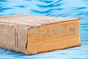 Old and used hardback books or text books on wooden table. Books and reading are essential for self improvement, gaining knowledge and success in our careers, business and personal lives. Copy space