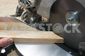 Carpenter tools on wooden table with sawdust. Circular Saw.