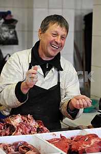A man sells meat on the market "Privoz" April 6, 2012