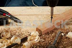 Carpenter tools on wooden table with sawdust. Circular Saw.
